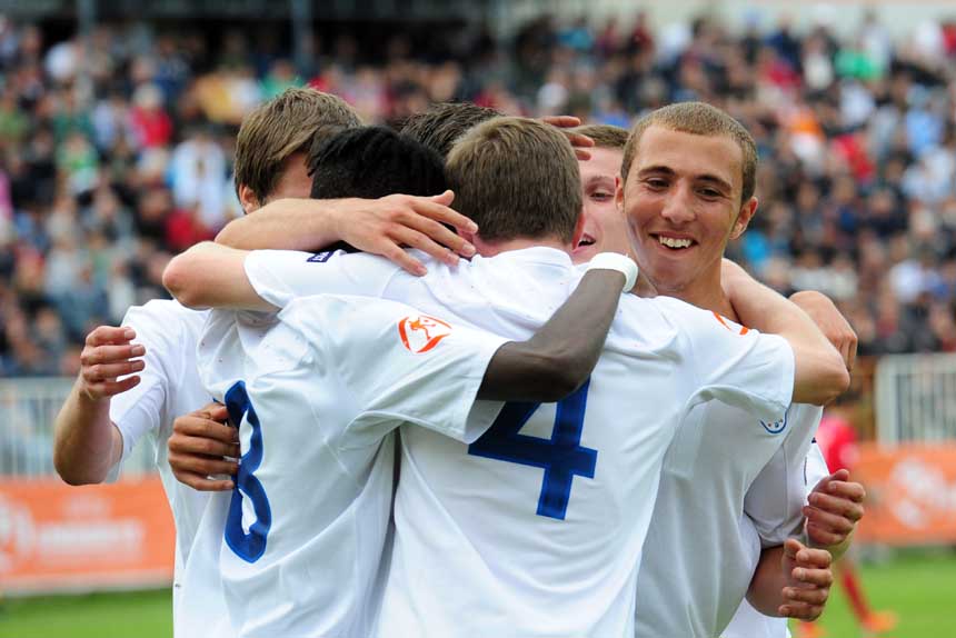 Hallam Hope (far right) is congratulated by team-mates after his goal against Serbia.
